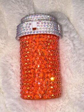 Orange rhinestone bottle with silver cap